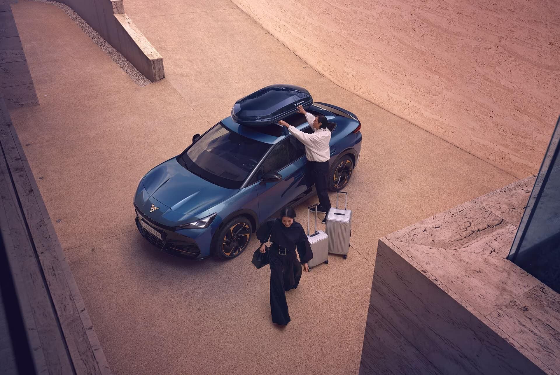 cupra tavascan vz, roadside assistance and birds eye view of vehicle, driver and cupra assistant by the car. 