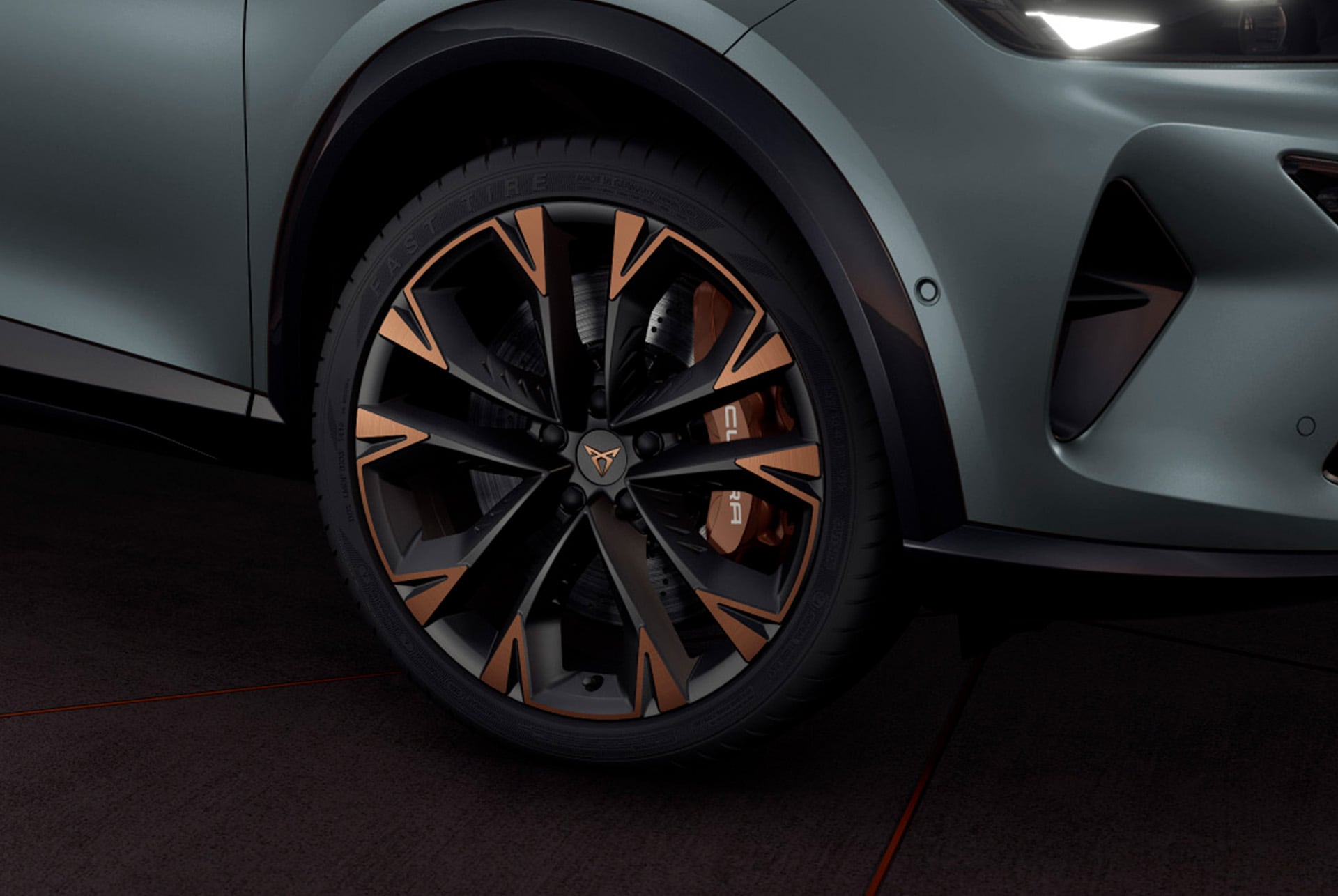 Exterior view of the CUPRA Formentor 2025 copper accent wheels, Akebono brakes, wing mirror, tyres, signature triangle eye LED headlights and CUPRA logo.