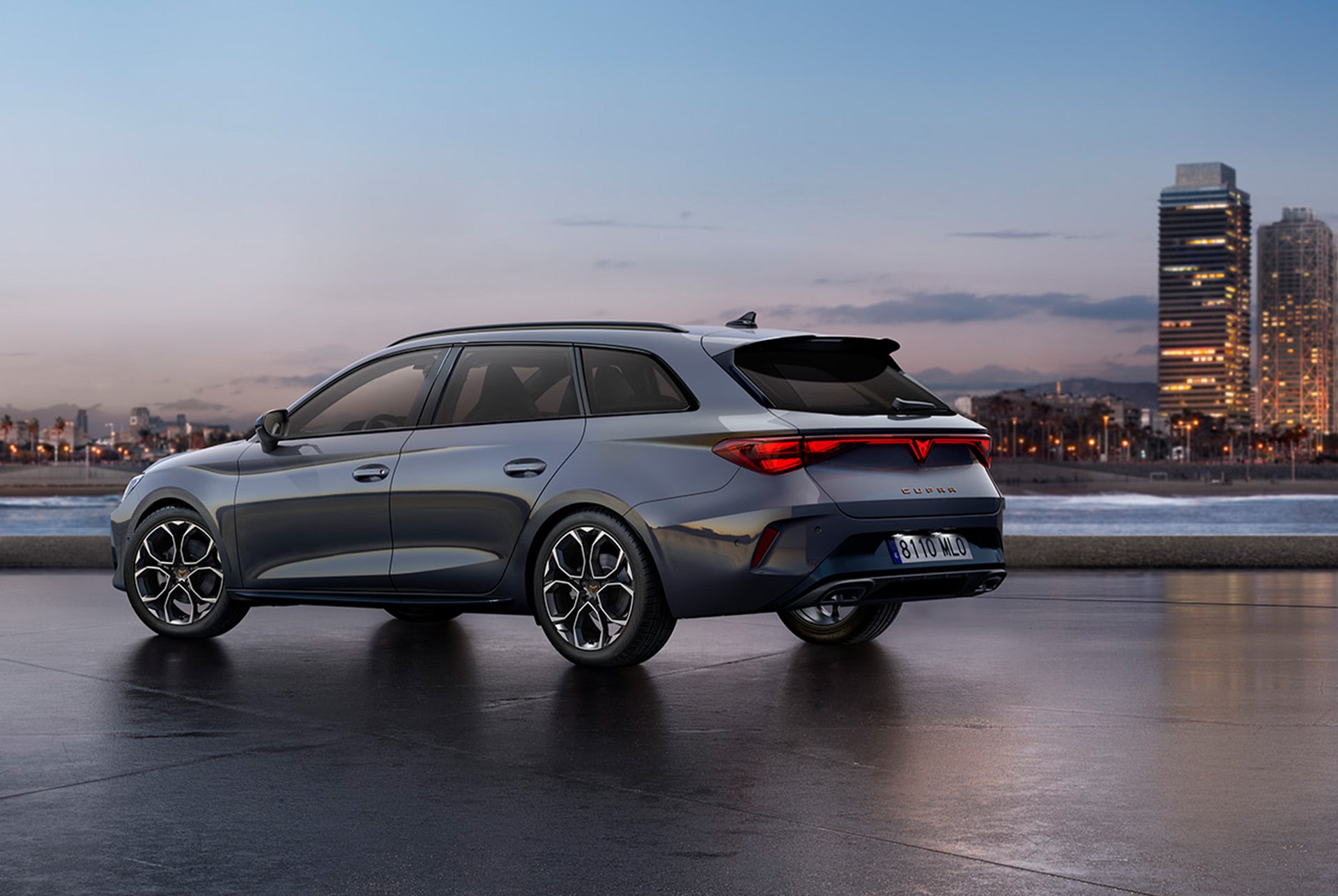 cupra leon sportstourer 2025 with advanced steering technology for an enhanced precision. The car is parked outdoors with the city in the background, at sunset.