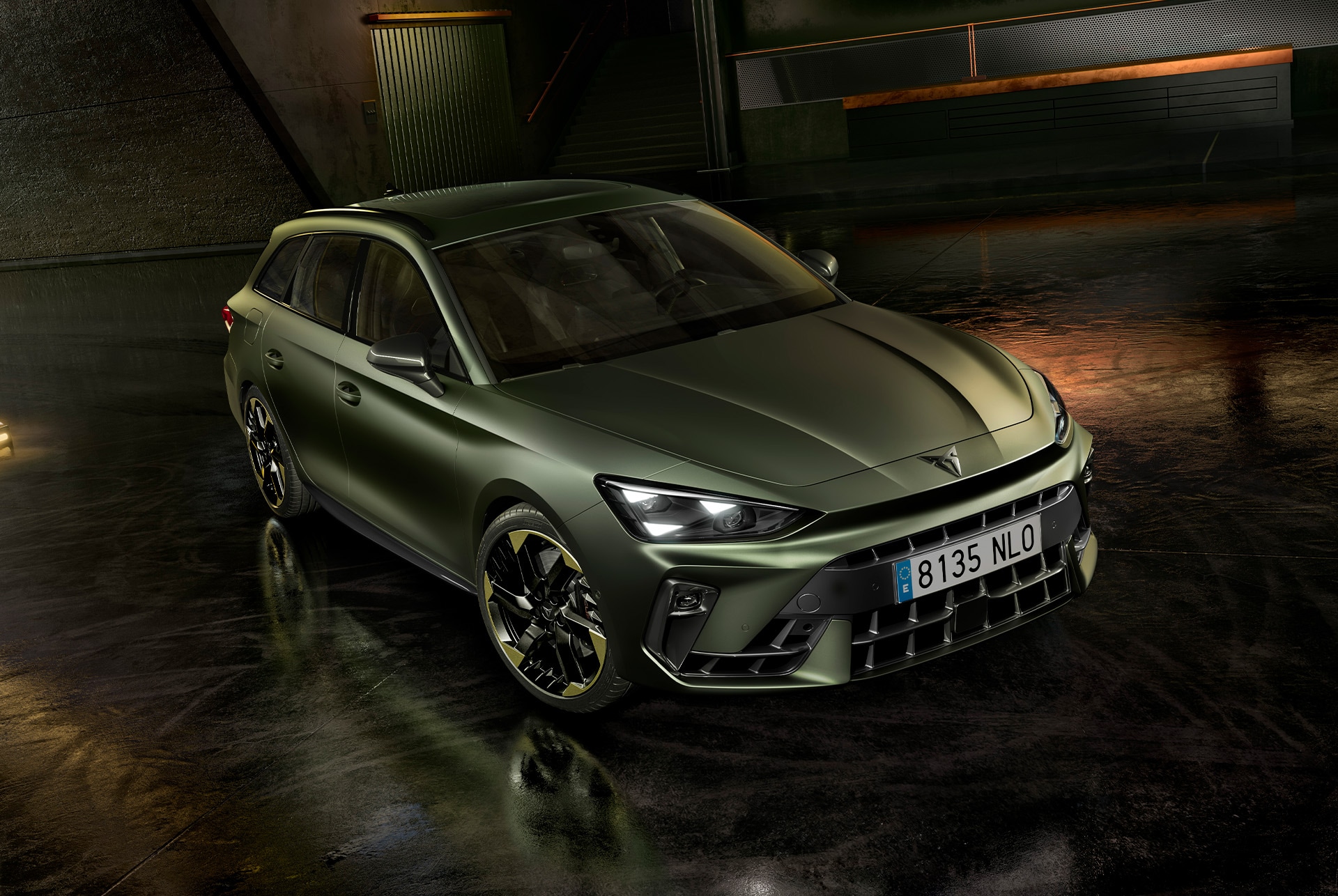 Exterior design of cupra leon sportstourer tribe edition in manganese matt and 19-inch alloy wheels in sulfur, parked in a parking garage. 