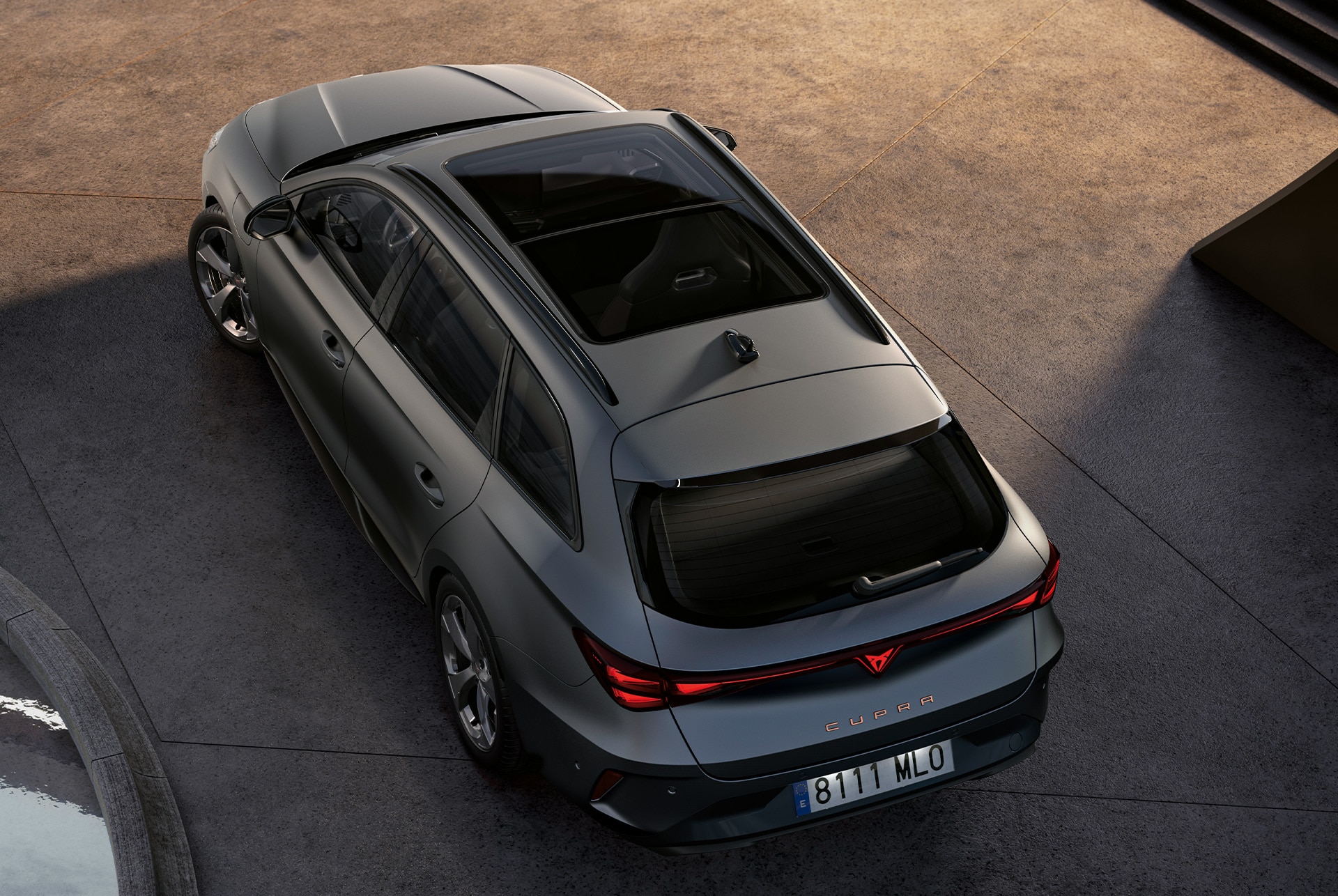 CUPRA Leon SP featuring the dark pack. The image showcases the CUPRA Leon SP enhanced with the dark pack, including sleek dark aluminium side skirts, a glossy black roof spoiler for an elegant sporty touch, and dark shadow garbi alloy wheels, completing its refined and dynamic design.