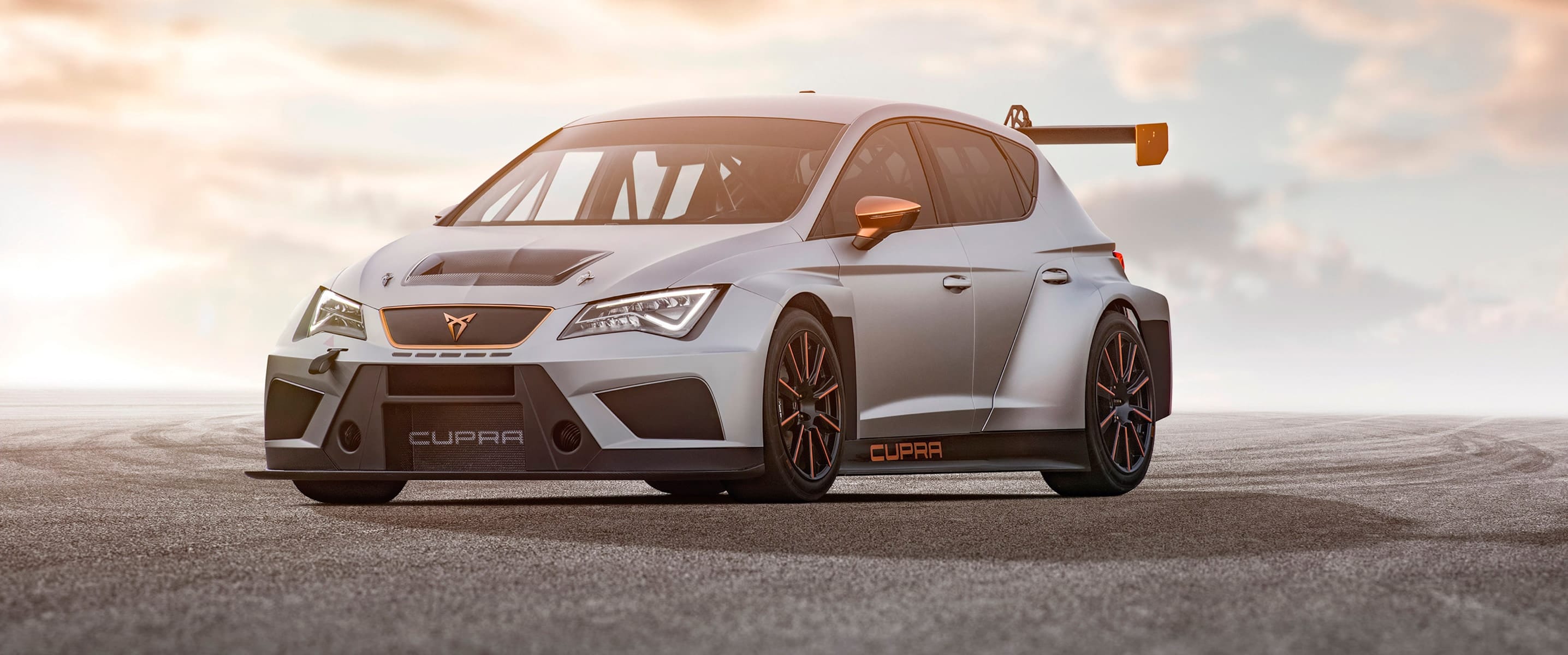 The CUPRA e-Racer in front and side view at sunset