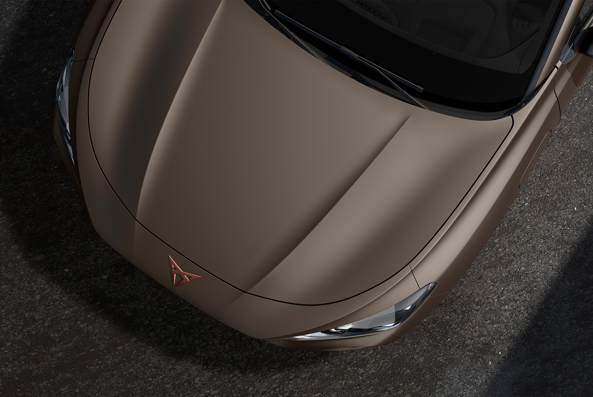 cupra terramar, graphene grey colour, top-down view of the front hood and headlights.