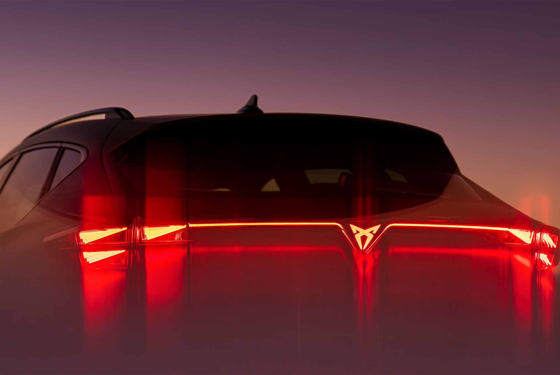new cupra formentor 2024 suv car design, led rear lights glowing at dusk with mountain silhouette background