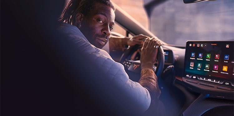 A driver looking over their shoulder inside a cupra car and smiling, illustrating the concept of enjoying subsidies and tax benefits to lower purchase costs and reduce vehicle registration taxes. A driver looking over their shoulder inside a cupra car and smiling, illustrating the concept of enjoying subsidies and tax benefits to lower purchase costs and reduce vehicle registration taxes.