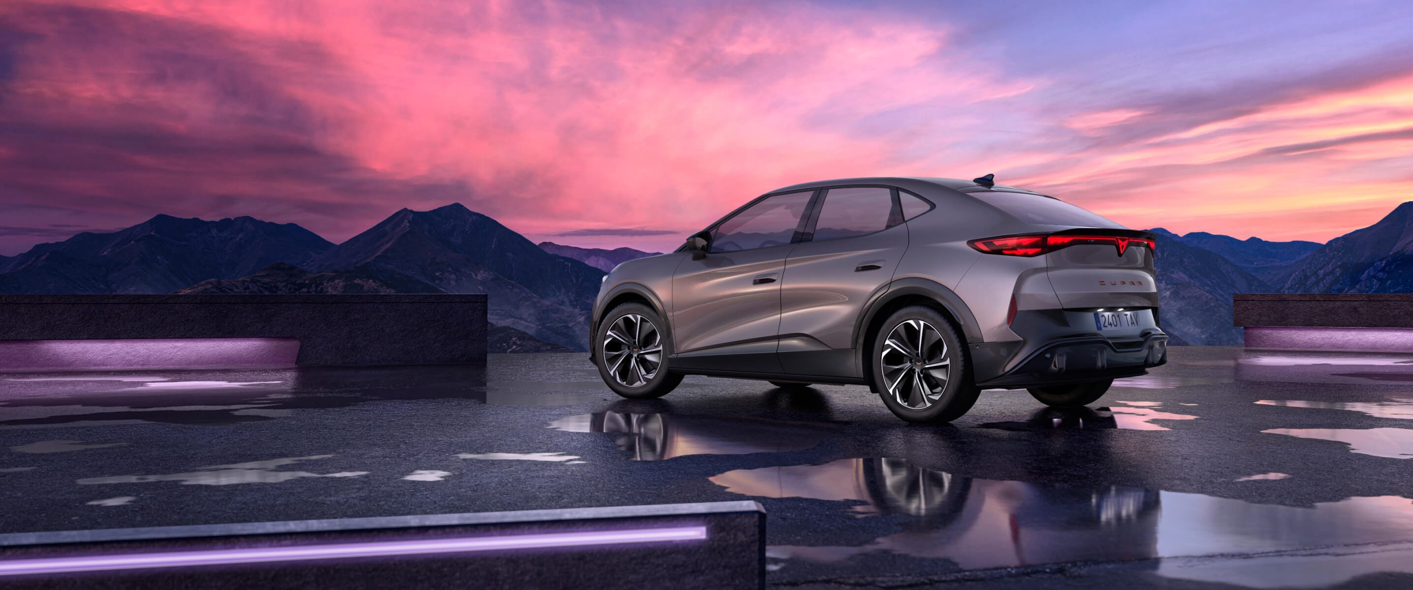 CUPRA Tavascan Endurance, three-quarter rear view in Atacama Desert color, under dramatic sunset sky.