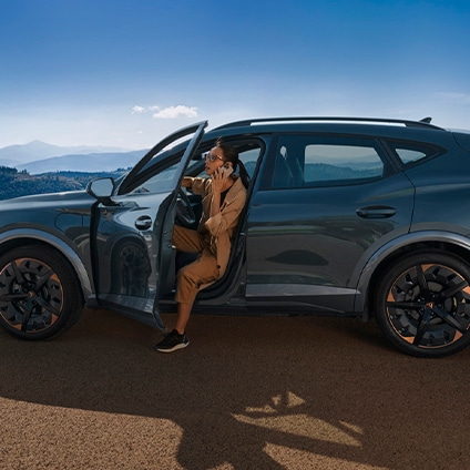 woman stepping out of cupra formentor vehicle that requires servicing and maintenance