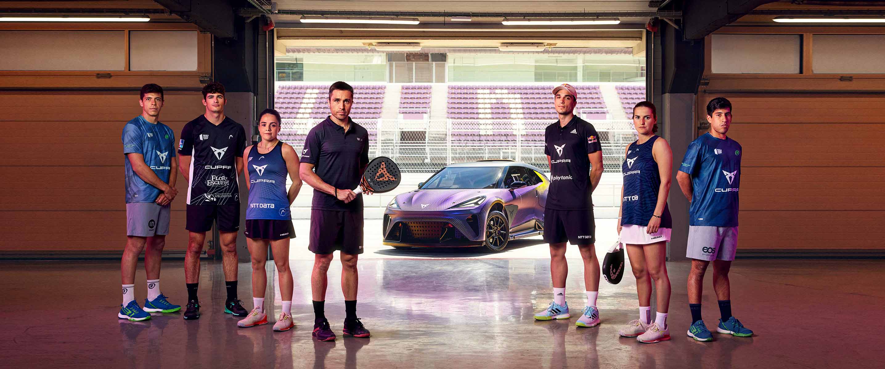 Four of the world’s top padel players – the new CUPRA ambassadors – standing with the CUPRA Ateca
