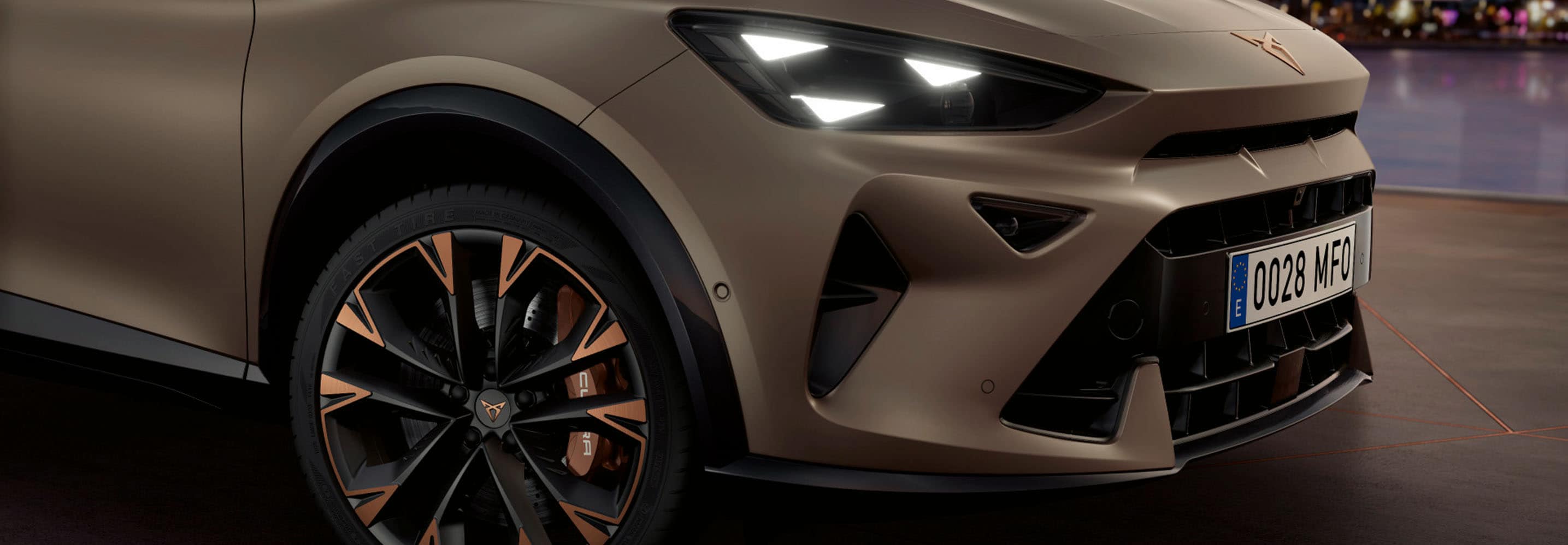 Cupra formentor on the road, close up of copper accent wheels and century bronze mat body. Ota updates for other cupra cars hero