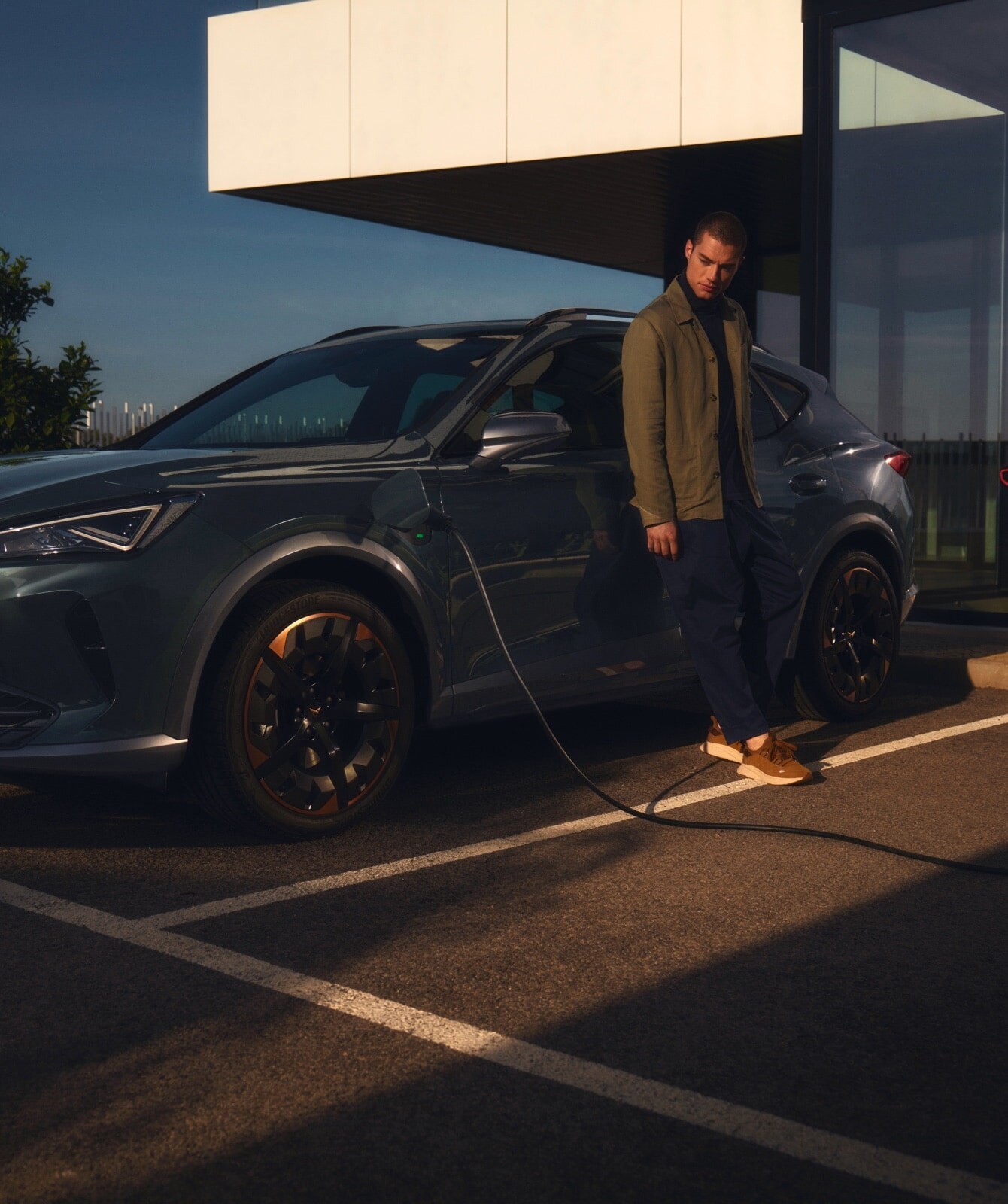 man-next-to-his-cupra-formentor-charging-point