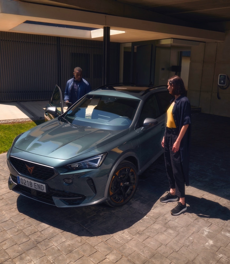 couple-standing-in-front-of-cupra-formentor